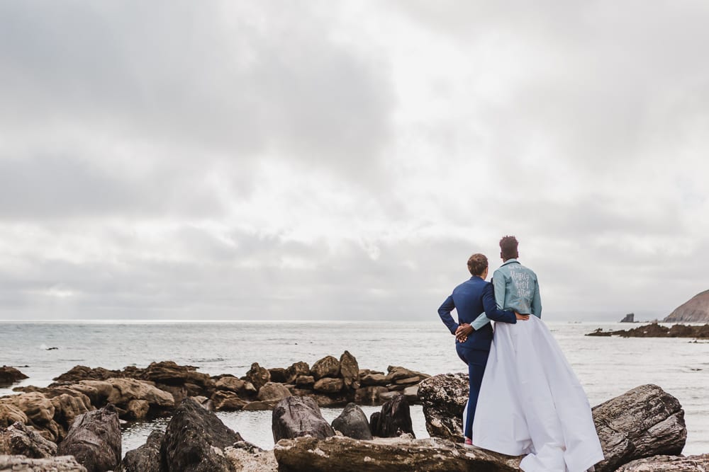Brides look out to sea in Cornwall wedding pictures